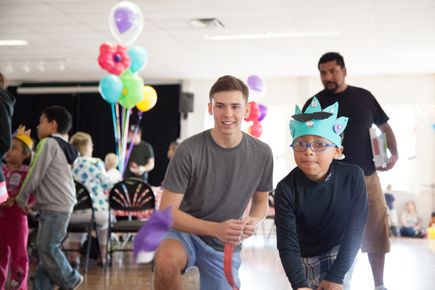 Kids playing carnival games at Summerfest 