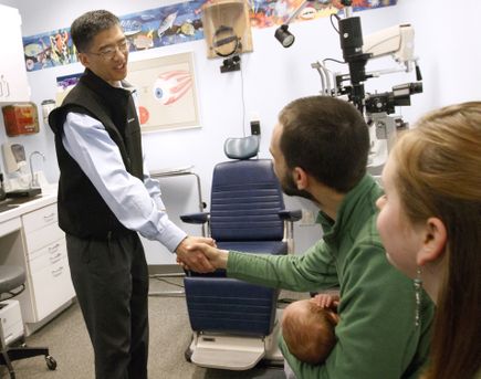 Dr. Michael Chiang (left) greets Jonathan (center) and Mackenzie Brown of Keizer, Oregon during an opthalmologist appointment for their 4-month-old baby Nathan at Casey Eye Institute Elks Children Eye Clinic in Portland, April 5, 2017. (OHSU/Kristyna Wentz-Graff) Retinopathy of prematurity (ROP)