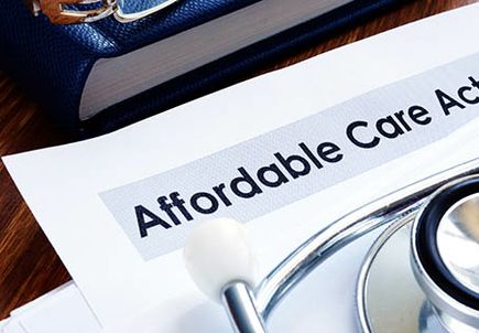 Affordable care act ACA or Obamacare and stethoscope.