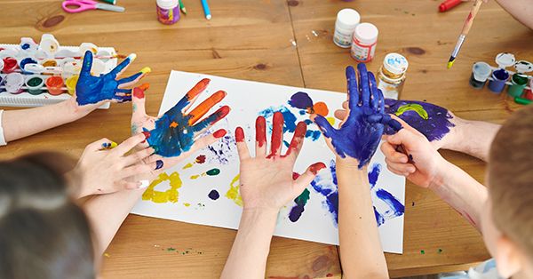 Kids with paint on hands for finger and hand painting projects. (Getty)