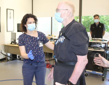 Marian Dale, M.D., M.C.R., works with patient