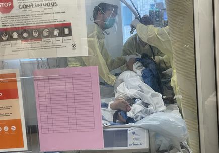 COVID-19 patient being turned