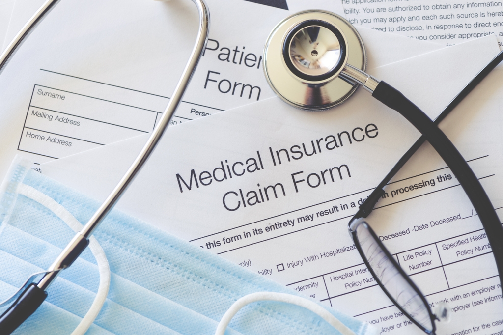 Image is of a stethoscope on top of Medicaid paperwork. Integrating mental with physical health care remains a work in progress, according to an OHSU-led study published today in JAMA Health Forum. (Getty Images)
