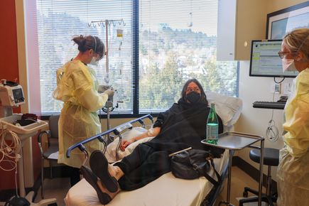 OHSU COVID-19 Clinic staff attend to a patient