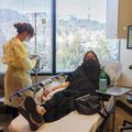 OHSU COVID-19 Clinic staff attend to a patient