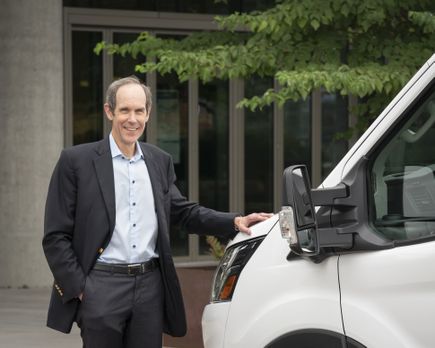 Dr. Brian Druker with KCI van