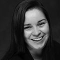 Allison Empey, M.D., has long straight dark hair, smiling in a black-and-white photo.