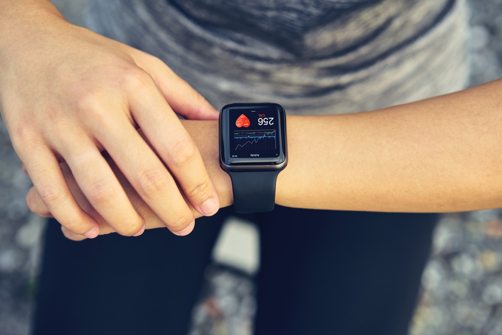 Person looks at their fitness device. Studies show fitness&nbsp;trackers can have a significant impact when users establish clearly defined objectives. (Getty Images)