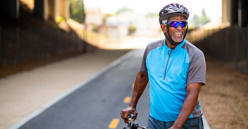 A man riding a bike for cardio outside. Oregon Health & Science University is participating in an international clinical trial testing a new drug for a common heart condition. Results published today found that it successfully increases oxygen use during exercise, making everyday tasks easier for people with hypertrophic cardiomyopathy. (Getty Images)