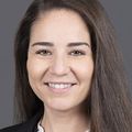 Courtney Temple, M.D. has long brown hair, smiling.