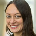Shandee Dixon, M.S., Ph.D., has long brown hair, smiling.