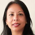 Wassana Yantasee, Ph.D., M.B.A., has straight long black hair and is smiling against a white background.