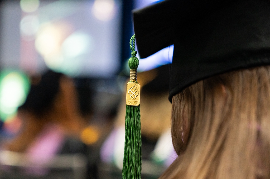 Image is of a graduate hat and OHSU tassel up close. Oregon Health & Science University is graduating 1,197 new healthcare, research, and education professionals during its all-school commencement ceremony today. (OHSU/Jordan Sleeth)