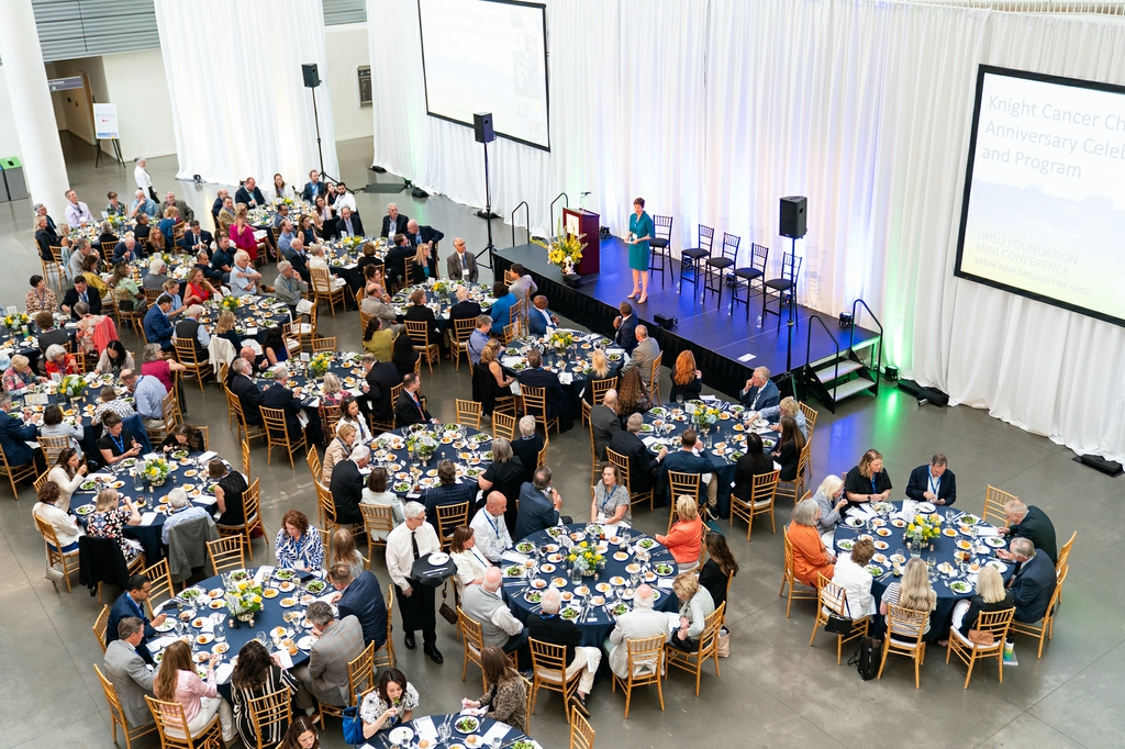 Knight Cancer Challenge anniversary celebration: photo is of a crowd shot above.