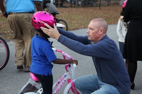 Robinson Nuclear Station employees help adjust bikes, fit helmets at the Boys and Girls Club IMG_4235
