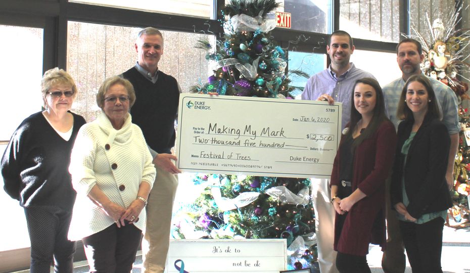 Making My Mark representatives received $2,500 from Duke Energy and Century 21 Hometown Realtors for winning first place in the 2019 Festival of Trees voting contest. From left to right, first row are Century 21 representatives Lee Morrison, Tana Evans and Stacey Jinks and Duke Energy’s World of Energy representative Mikayla Kreuzberger; back row Duke Energy General Manager of Nuclear Engineering Todd Grant and Making My Mark representatives Alden Broome and James Powell. Century 21 Hometown Realtors are participating in the 2020 Virtual Festival of Trees event and sponsoring Making My Mark for a second time. First Place_Making My Mark
