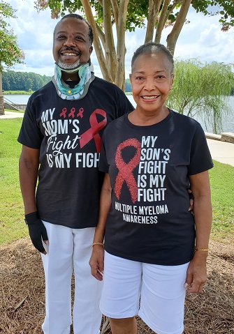 Tim Cooper with his mother wearing MM shirts