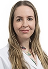 Dr. Ludimila Cavalcante wears a white coat and smiles at the camera.