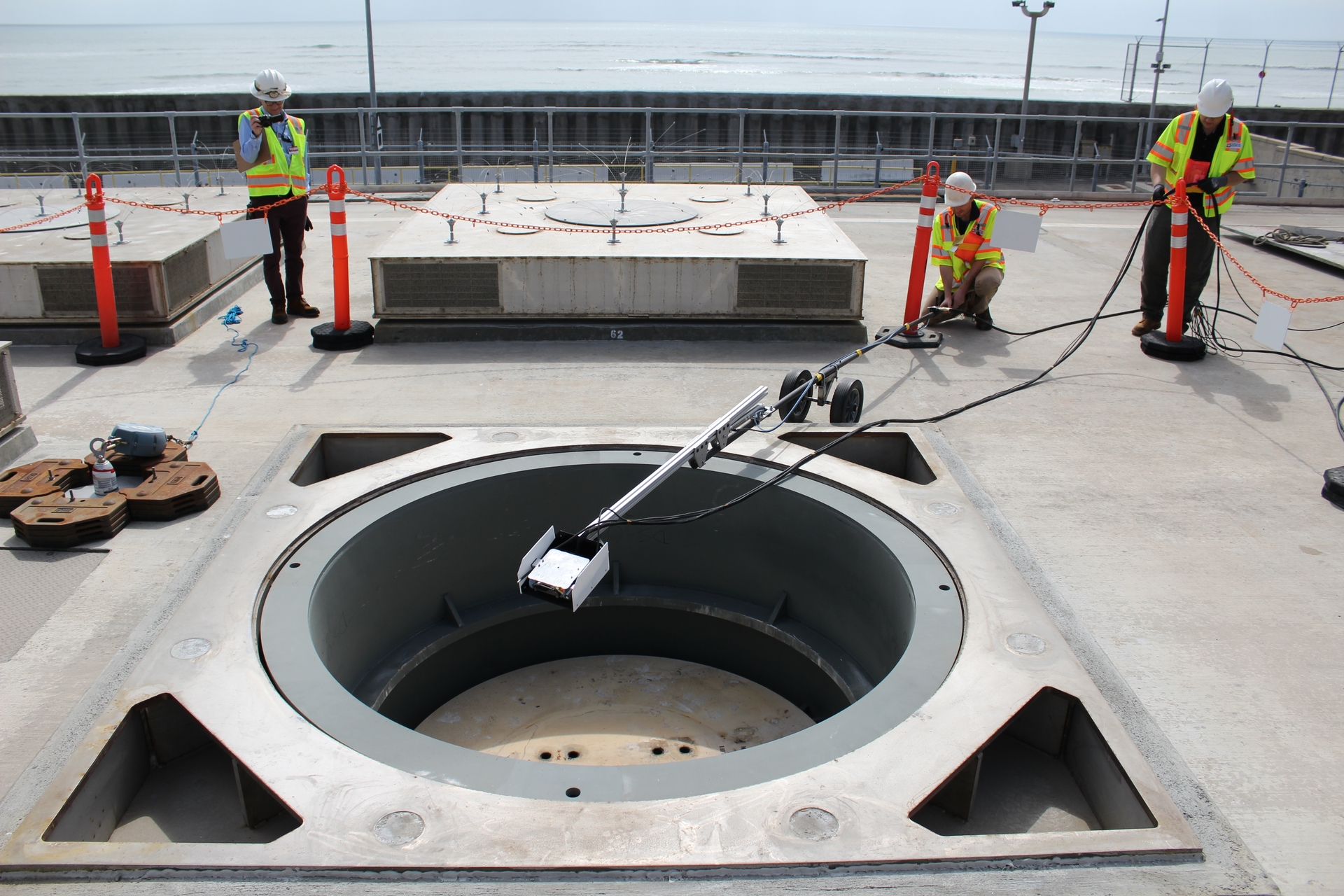 The robot is placed into the cavity enclosure container to begin the visual inspection of a loaded multipurpose canister. IMG_3626