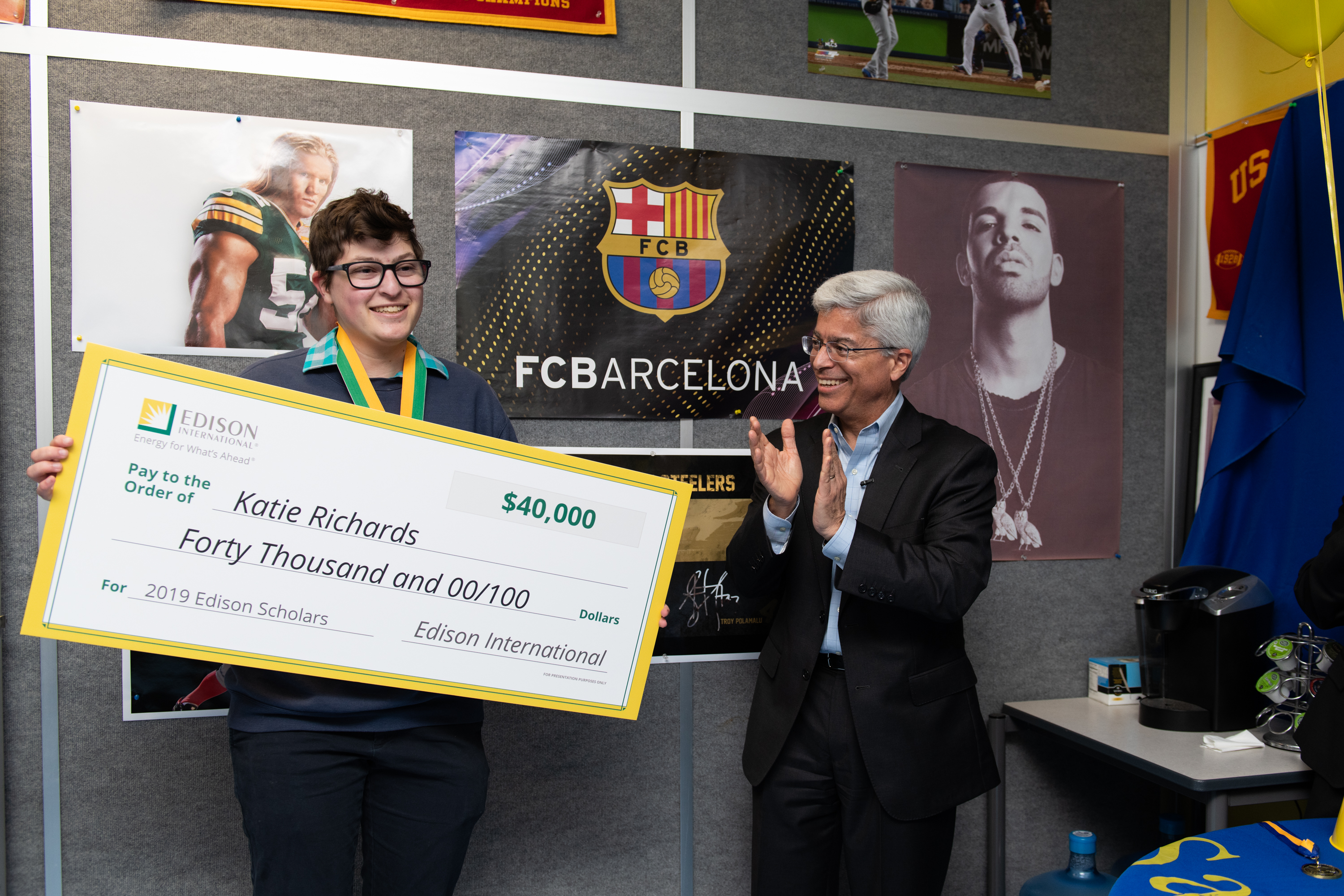 Pedro Pizarro, Edison International president and CEO, surprises Katie Richards, 17, with an Edison Scholars award.
