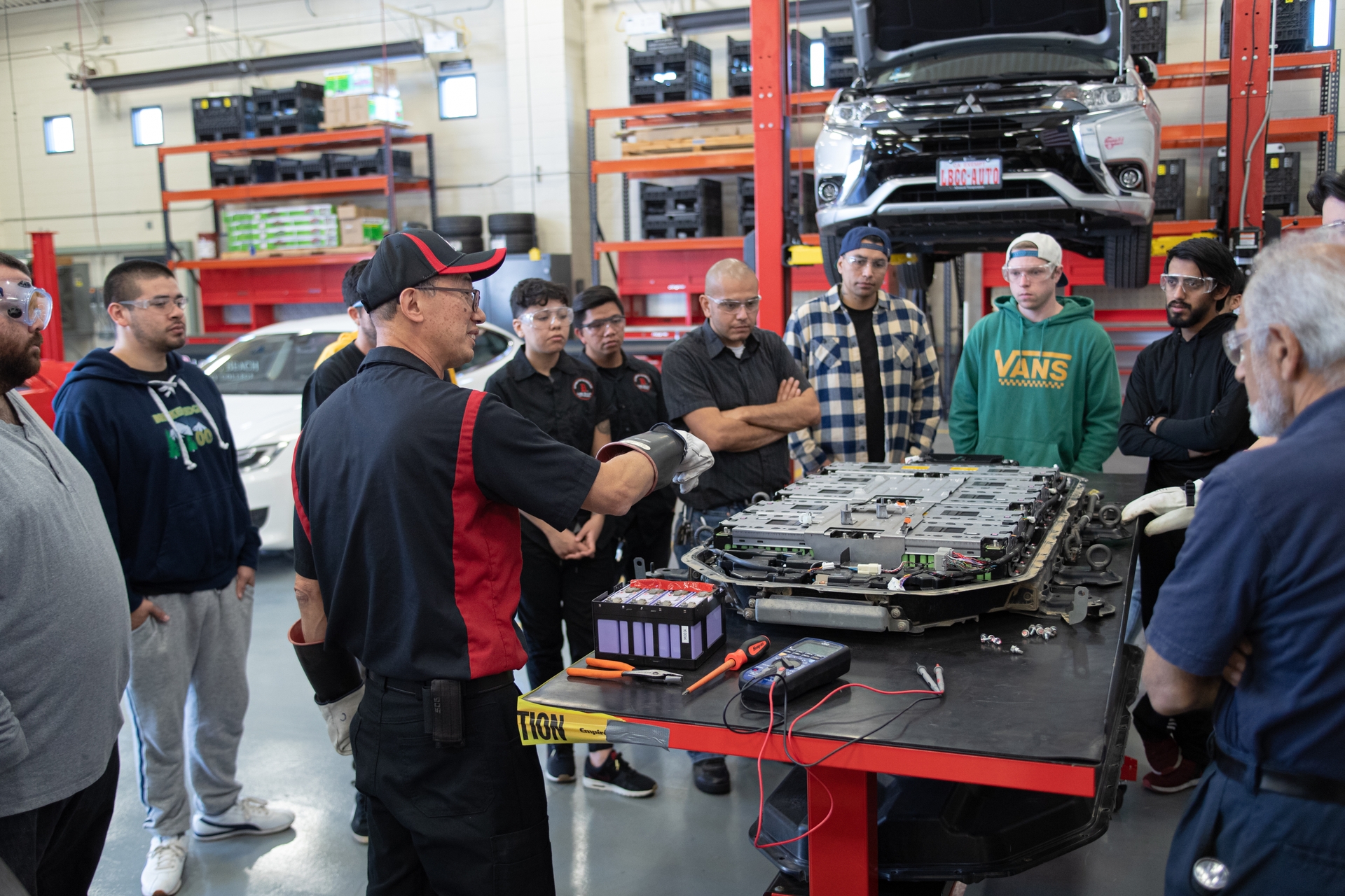 Students learn how to service electric cars and heavy-duty electric vehicles in Long Beach City College’s Advanced Transportation Technology Program.