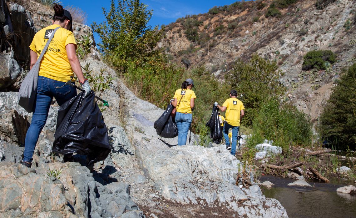 Volunteers removed about two dozen trash bags from the San Gabriel River and its banks.