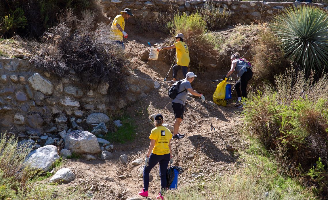 Teamwork on display along the banks of the San Gabriel River.