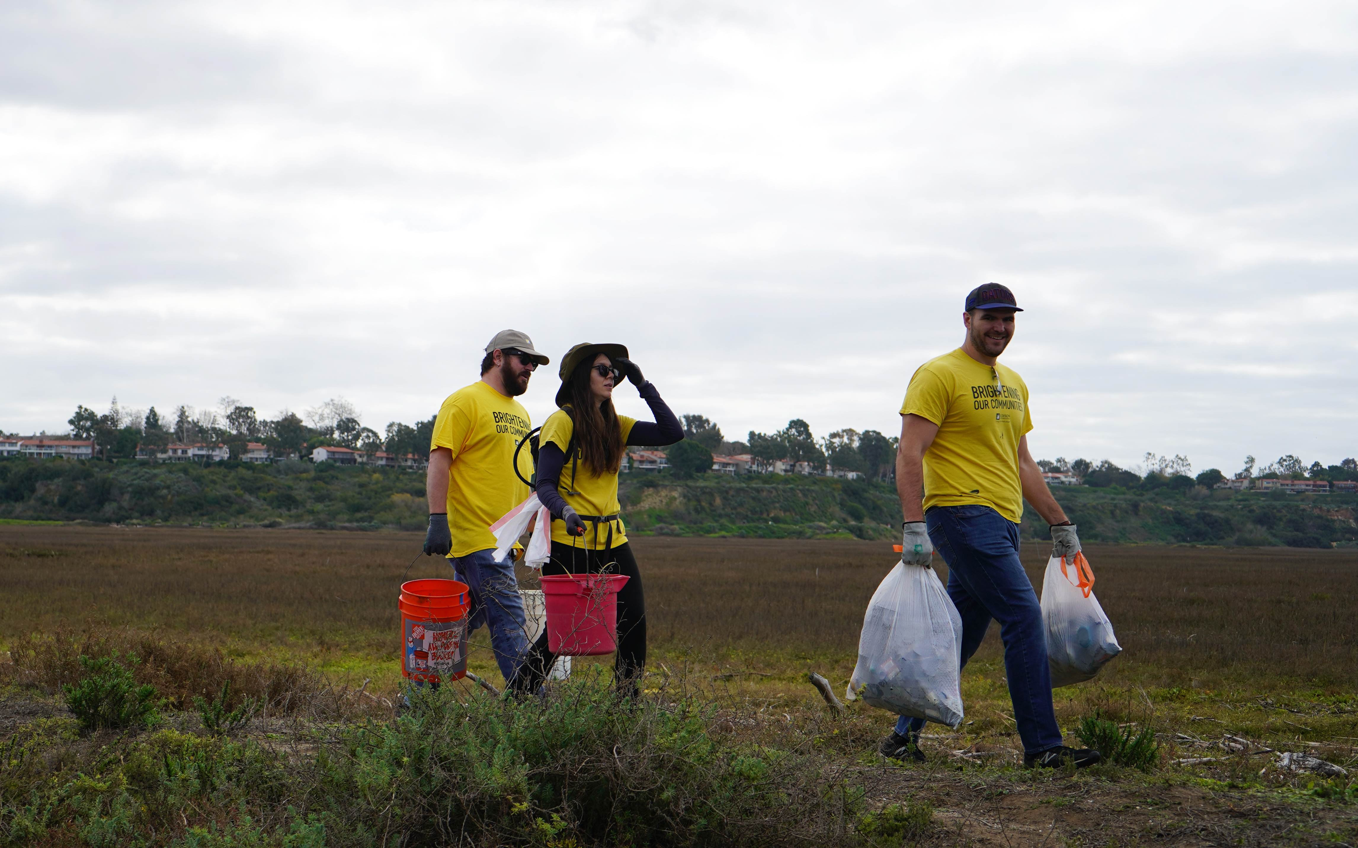 After the recent California rainstorms brought in an array of trash and debris, (left to right) Kyle Straub, SCE Energy Advisor Nicole Straub and Engineering Sr. Project Manager Nolan Kelleher got to work immediately to help restore the beauty of the Upper Newport Bay.
