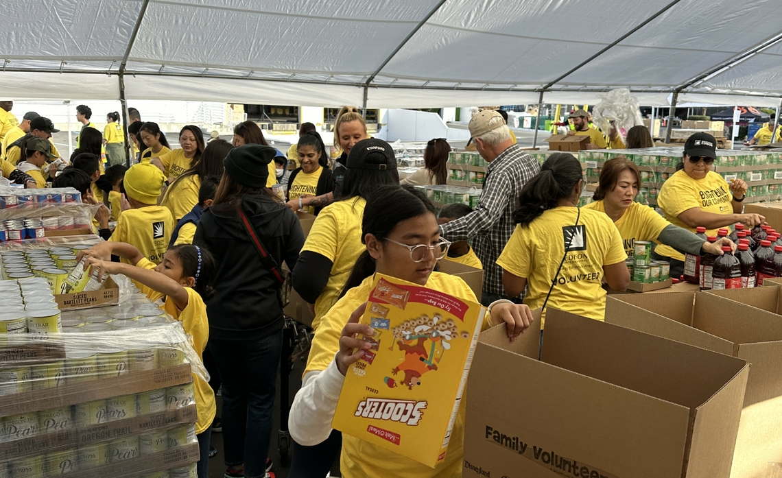 At this year’s event, 240 employees, friends, and family volunteers worked together to pack 4,937 boxes of food. 