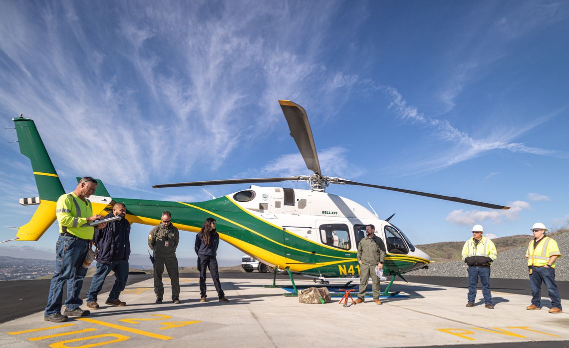 Mark Joslen (left), a foreman with SCE's Helicopter Assisted Line Organization team, leads a safety briefing before the day's work begins.