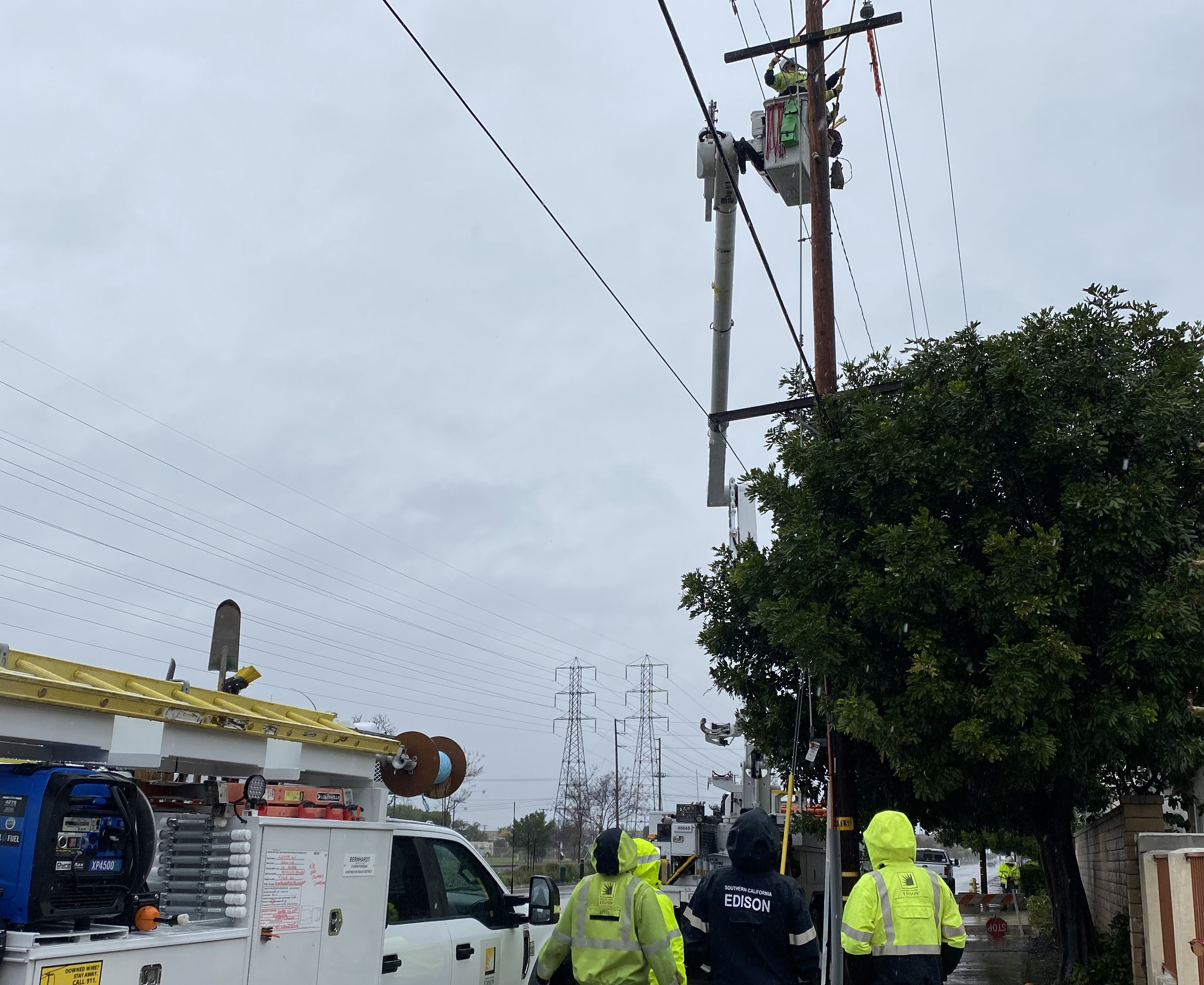 An SCE crew in Westminster replaces damaged connectors during a rainstorm.