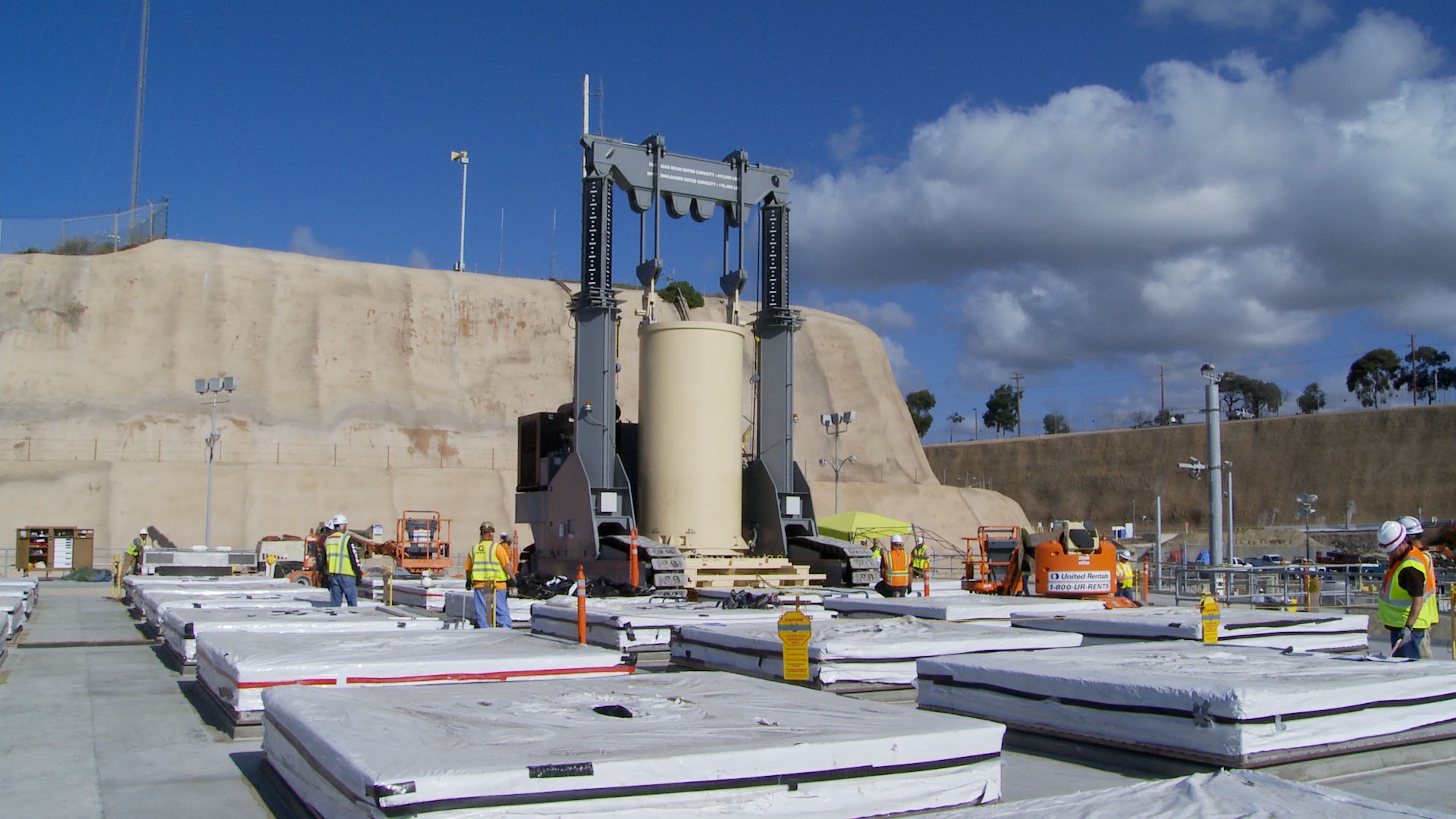 The spent fuel is stored safely in stainless steel canisters encased in reinforced concrete structures.