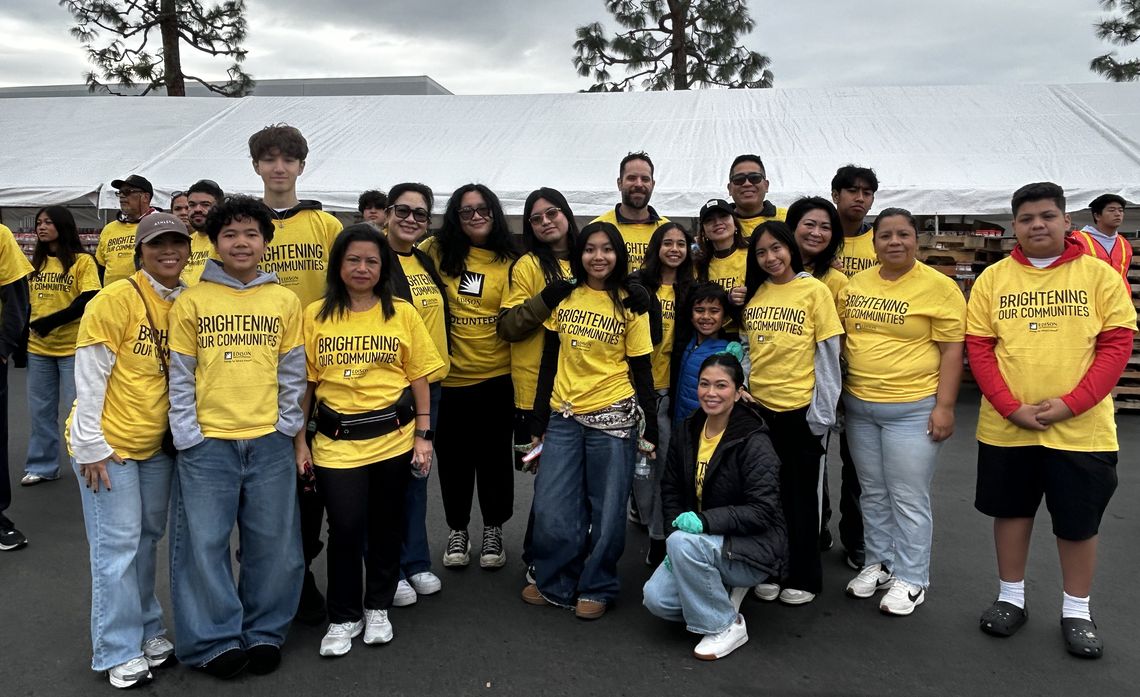 With a dozen of his friends by his side, Noah Loyola Renfeldt (third from left) joins Edison volunteers on National Family Volunteer Day.