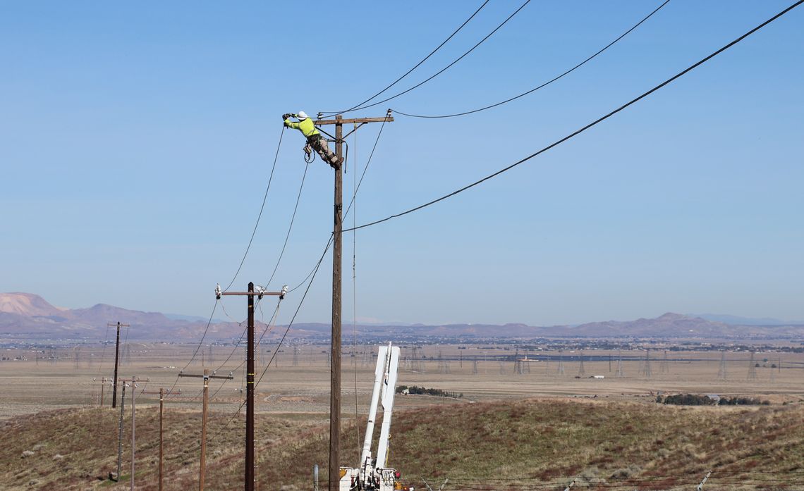Crews install over 95 miles of covered conductor near Lake Hughes, reducing the need for power shutoffs during high fire risk weather.
