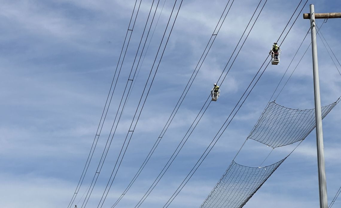 As an extra safety precaution, netting was installed to protect drivers as crews worked over the freeway. 