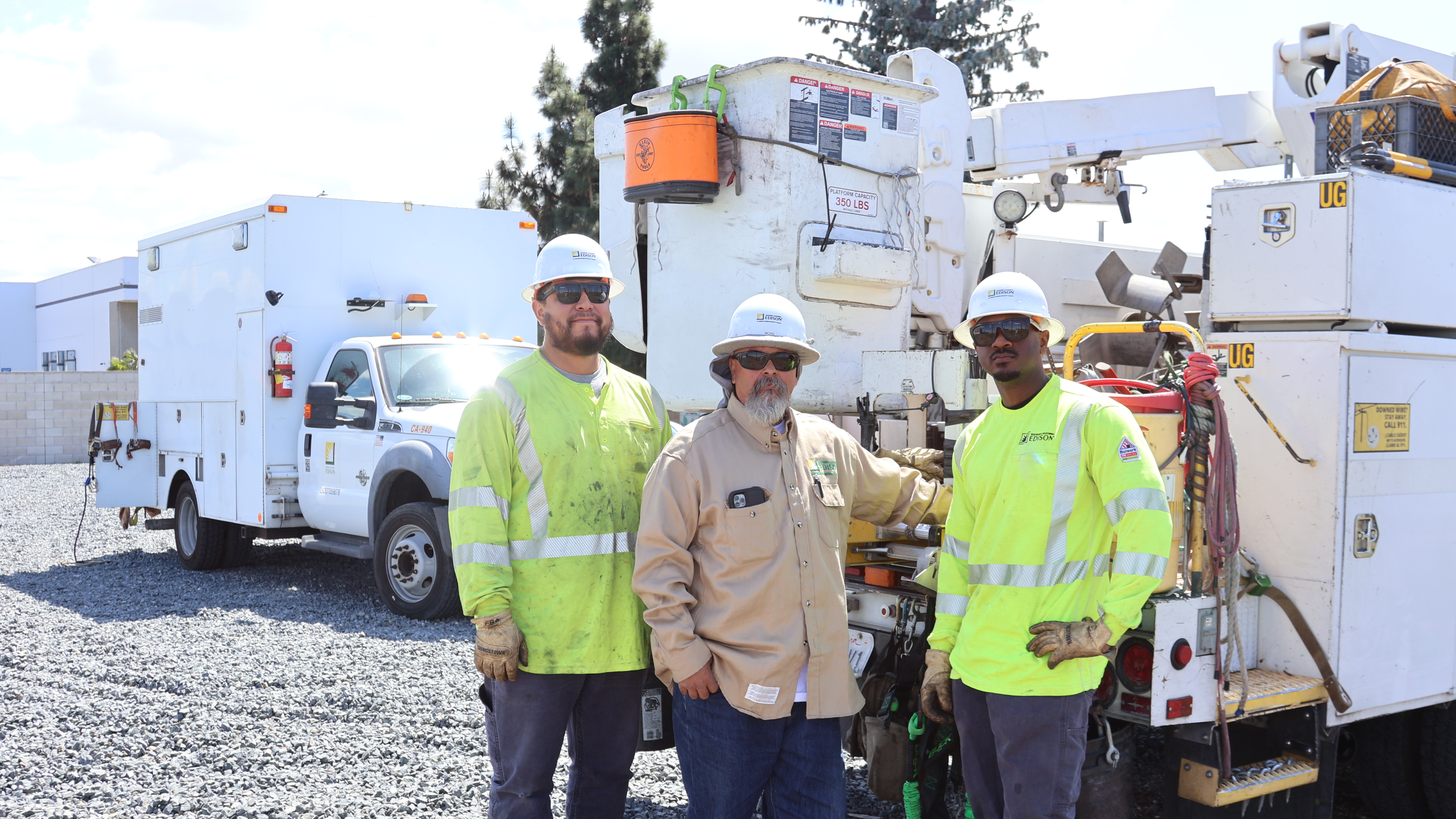 SCE lineworkers, Jose Torres (L), Ray Sanchez, and Theo Cason were the first on scene at a residential fire in Garden Grove. 