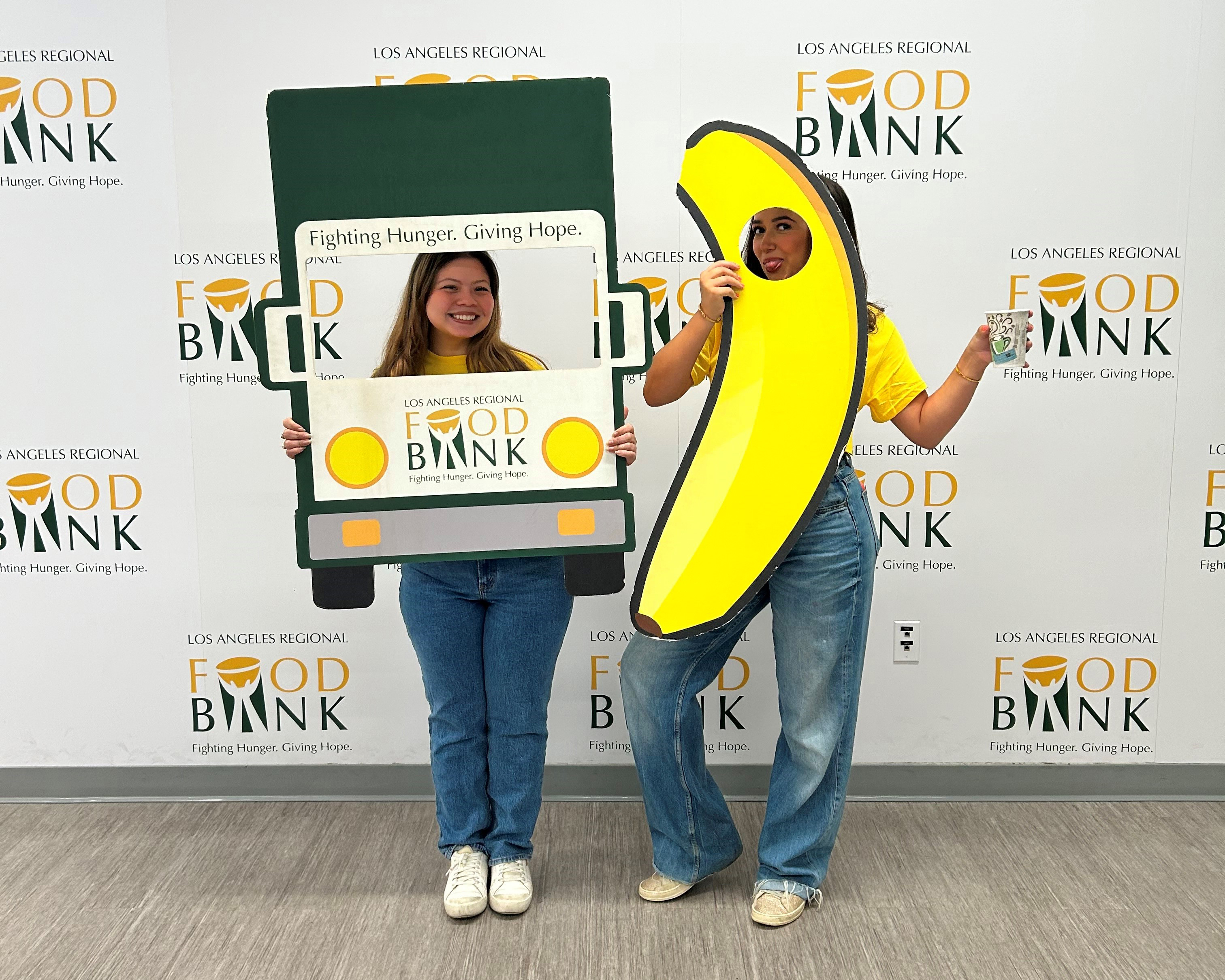 Lopez (L) attends an SCE volunteer event at the Los Angeles Food Bank.