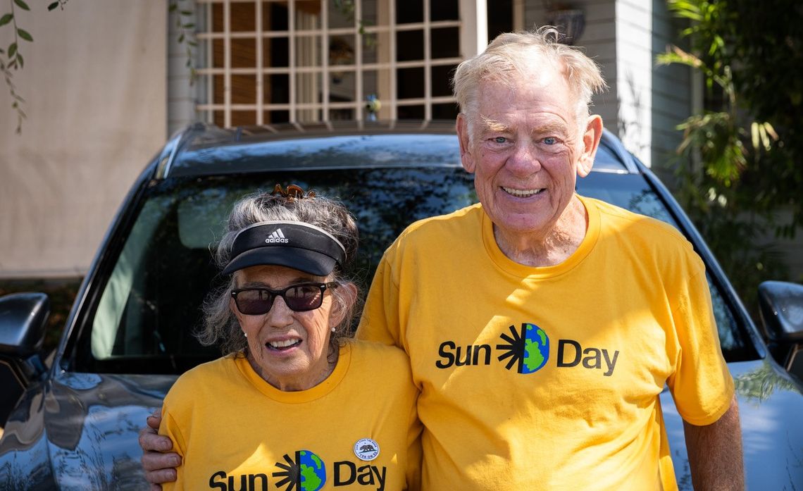 Monica Sena (L) and Joe Beatty (R) have driven their Chevy Volt since 2011, powering most of their miles with electricity generated at home.