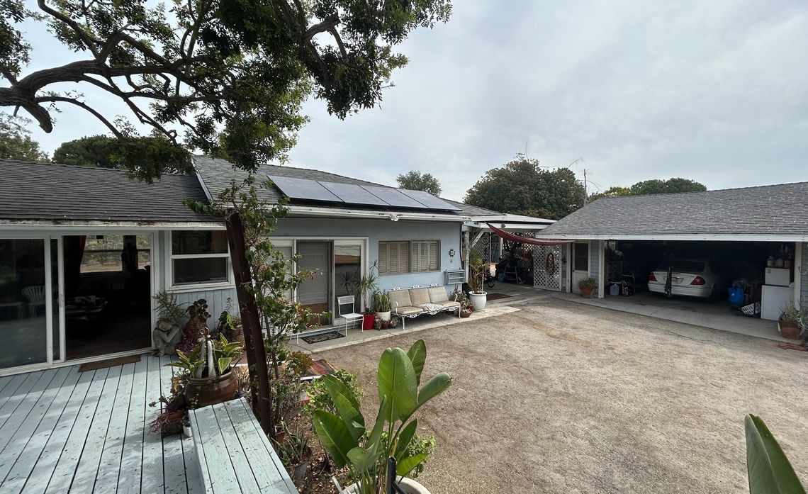 A system that pairs solar panels with battery storage powers many electric appliances in Monica Sena and Joe Beatty's home.