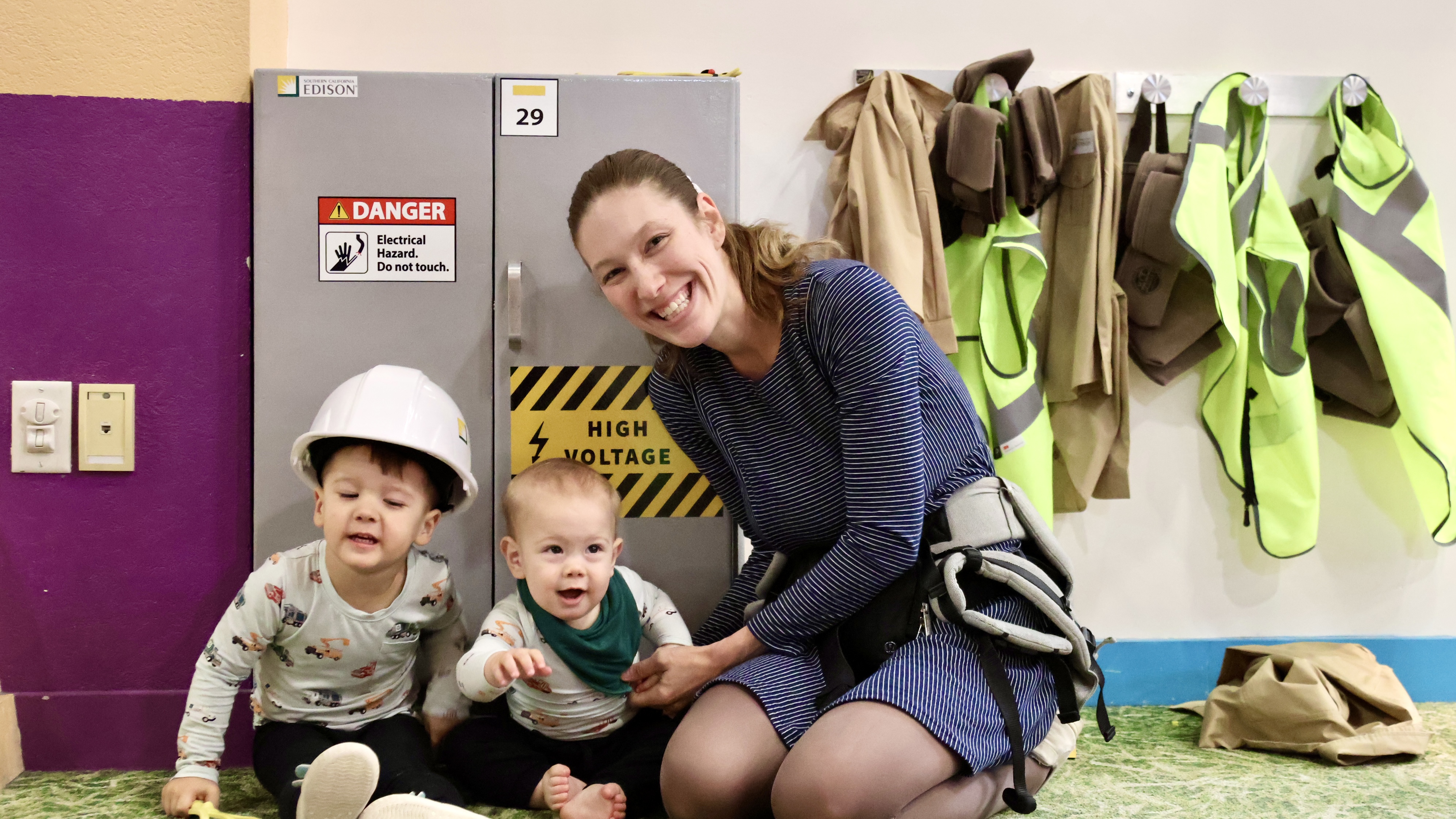 Alexa Johnsen and her two sons enjoy the opening of the SCE exhibit at Pretend City Children's Museum. 