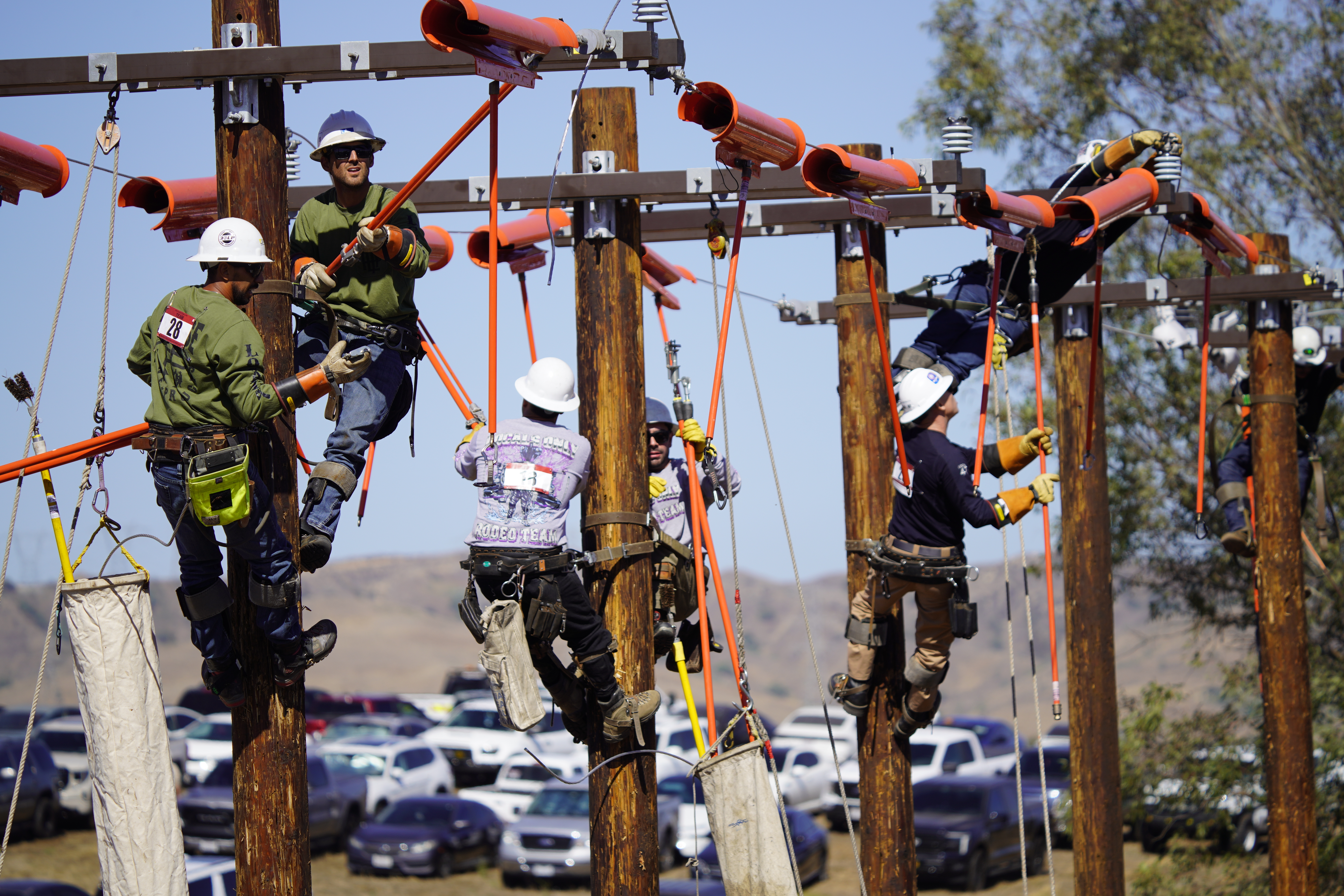 Brandon Gloria and David Angove work together to safely and quickly complete one of the events at SCE's Lineman's Rodeo. 