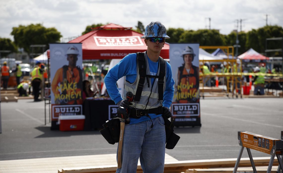 Aspiring lineman Cameron Gomez and his team from Rosamond High Early College Campus construct a tiny house during the Design Build Competition.
