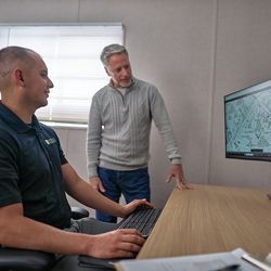 Community members often visit SCE customer service representative Enrique Alvarez (left) at the Altadena Rebuild & Community Hub to get help with their electric service, rebuilding timelines and project requirements.