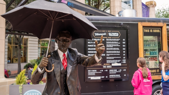 "Allow Me" Umbrella Man Statue
