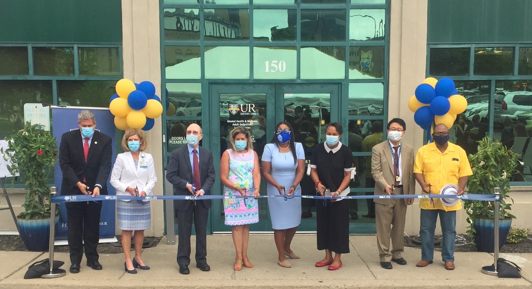 Local officials joined UR Medicine to celebrate the opening of a new community-based outpatient mental health center in Rochester. Cutting the ribbon, from left, are Monroe County Executive Adam Bello, Strong Memorial Hospital COO Kathy Parrinello, URMC CEO Mark Taubman, M.D., Lazos Fuertes Director Telva Olivares, M.D., Rochester Mayor Lovely Warren, Director of Adult Ambulatory Services Kathryn Castle, Ph.D., Psychiatry Department Chair Ben Lee, M.D., and Rochester Councilmember Michael Patterson. Officials cut a ribbon to open a new mental health center in the city of Rochester