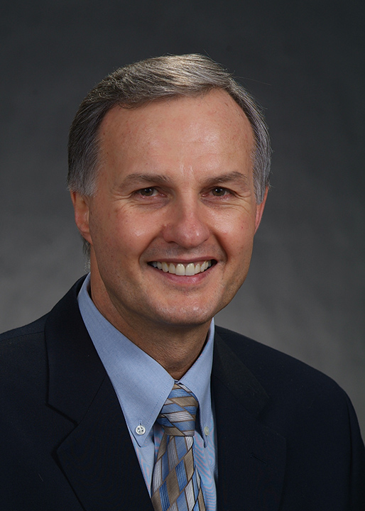A portrait of Dr. Emile Rossouw.