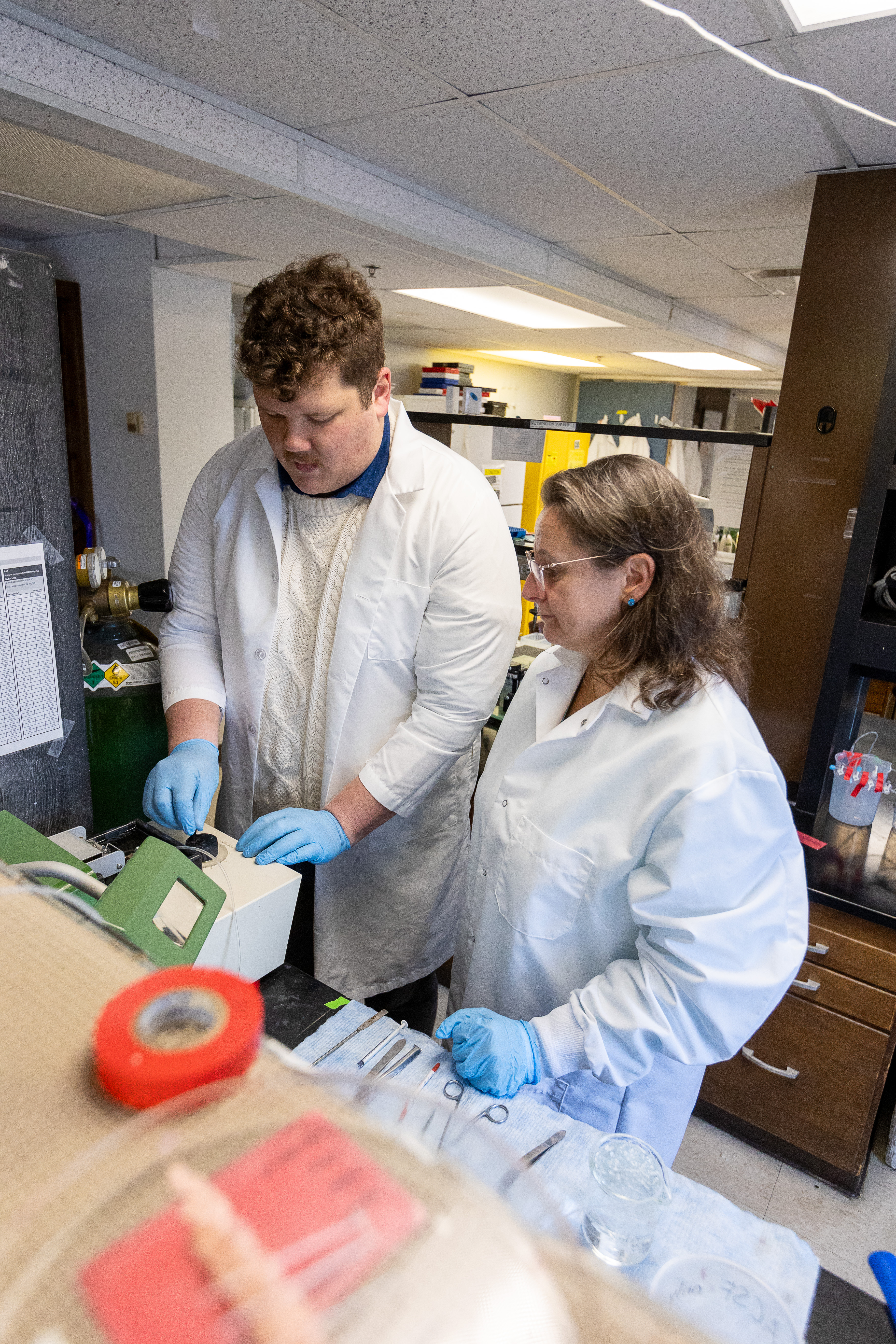 From left: Neuroscience Graduate Student Mark Stoessel works with Ania Majewska, PhD, at bench in her lab at the Medical Center.