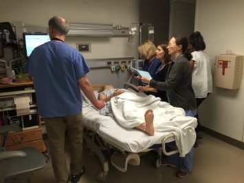healthcare professionals respond to an emergency in a simulated environment