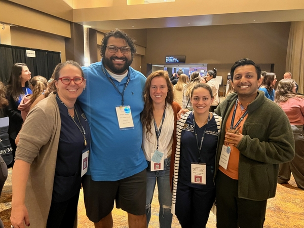 Group of university of rochester department of obstetrics and gynecology members stand shoulder to shoulder
