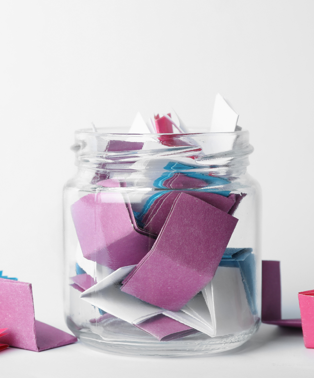 gratitude jar, a jar full of small pieces of paper with messages of gratitude written on them.
